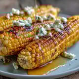 Fresh microwave corn on the cob with golden butter melting over tender, juicy kernels—ready in just 5 minutes for a quick, satisfying side dish.