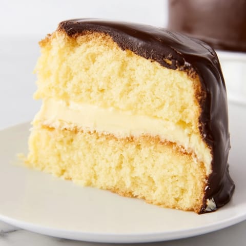 A classic American dessert, this Ho Ho Cake is drizzled in glossy, dark chocolate.