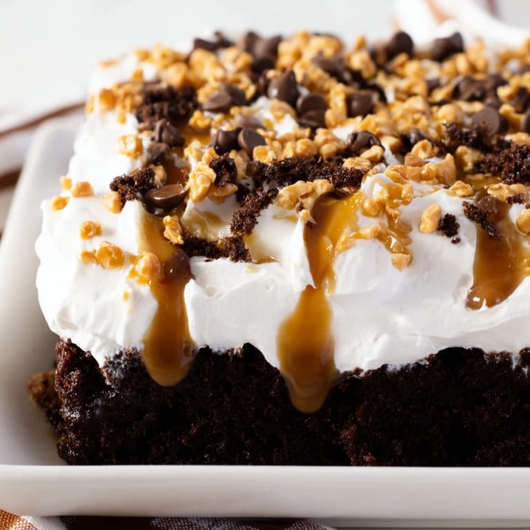 This Better Than Sex Cake shows its rich chocolate cake base, drenched in caramel, ready to be enjoyed.