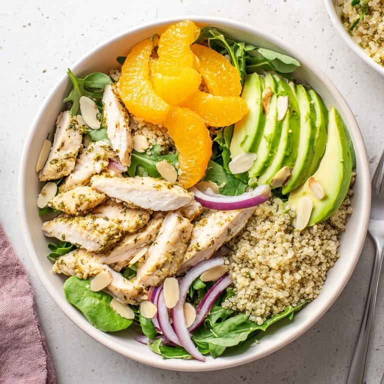 Fresh greens and toasted almonds top this healthy Citrus Herb Chicken Salad, drizzled with a zesty homemade citrus vinaigrette.  