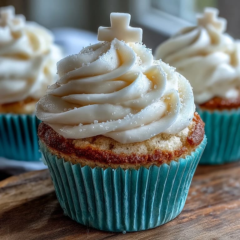 Tender vanilla Communion cupcakes, frosted and topped with elegant fondant crosses.
