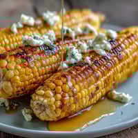 Fresh microwave corn on the cob with golden butter melting over tender, juicy kernels—ready in just 5 minutes for a quick, satisfying side dish.